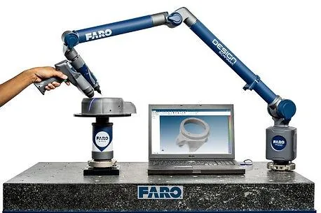 Portable measuring arm inspecting a part
